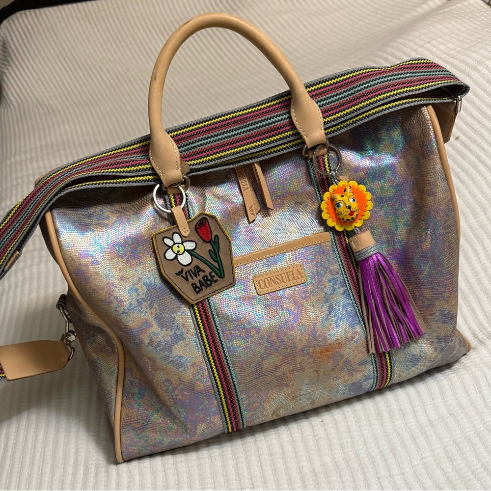 Consuela Iridescent Jetsetter Bag Tan&Purple Accents Has an extra leopard tassel